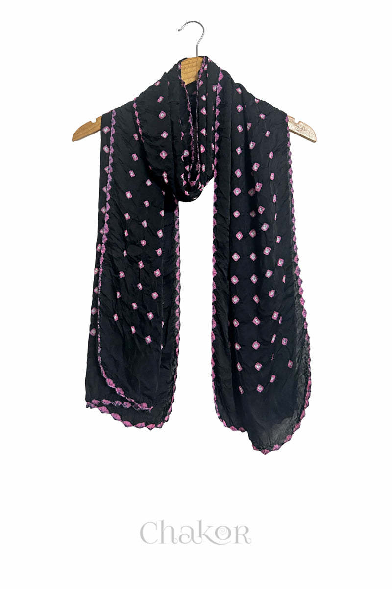 black Bandhani modal stole displayed on wooden hanger showing full length, drape and tie-dye layout.
