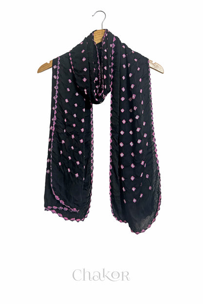 black Bandhani modal stole displayed on wooden hanger showing full length, drape and tie-dye layout.
