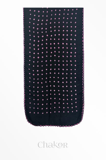 Flat view of black Bandhani modal stole showing evenly spaced tie-dye pattern.
