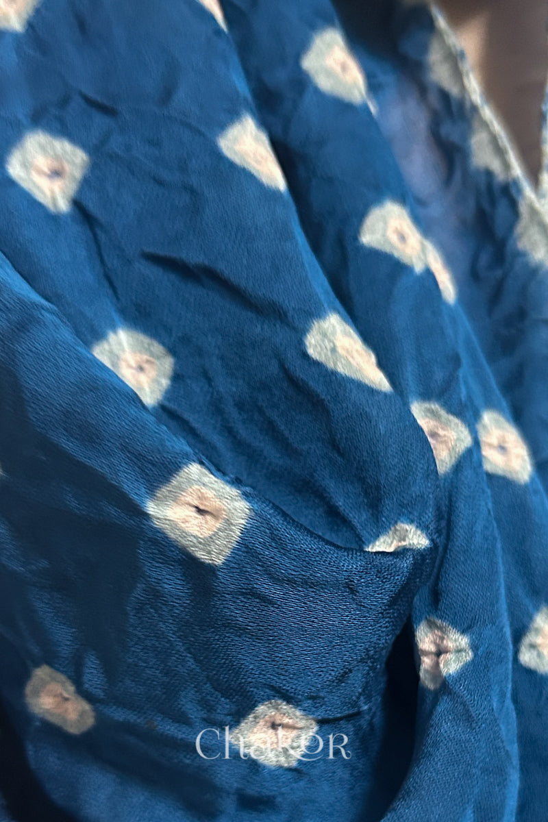 Close-up of hand tie-dye texture on indigo Bandhani stole in modal fabric.
