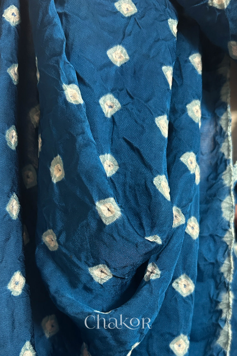 Close-up of hand tie-dye texture on indigo Bandhani stole in modal fabric.
