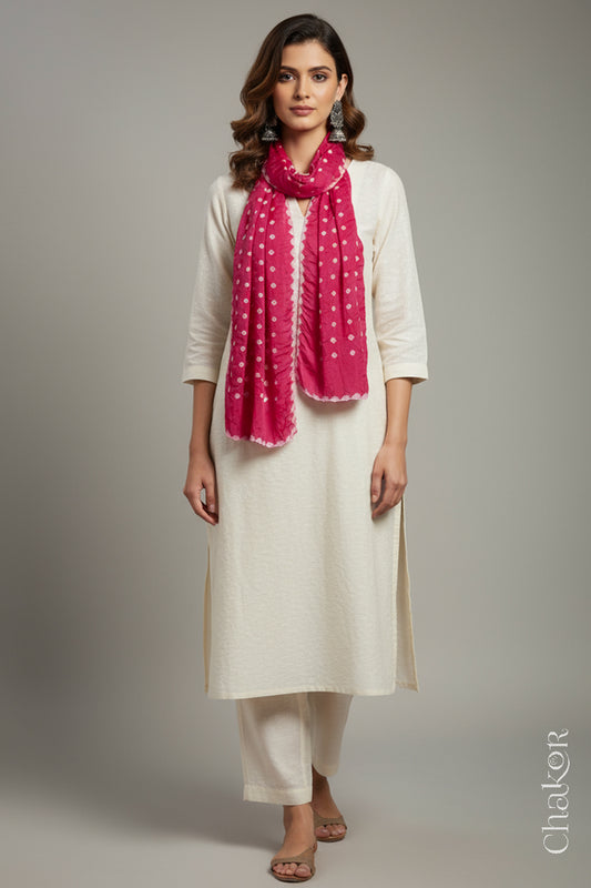 Model wearing a pink Bandhani modal stole styled over a kurta, showing hand tie-dye patterns.
