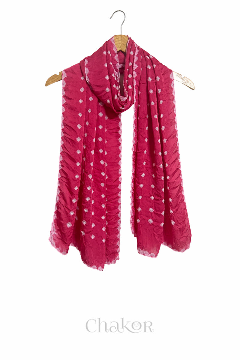 pink Bandhani modal stole displayed on wooden hanger showing full length, drape and tie-dye layout.
