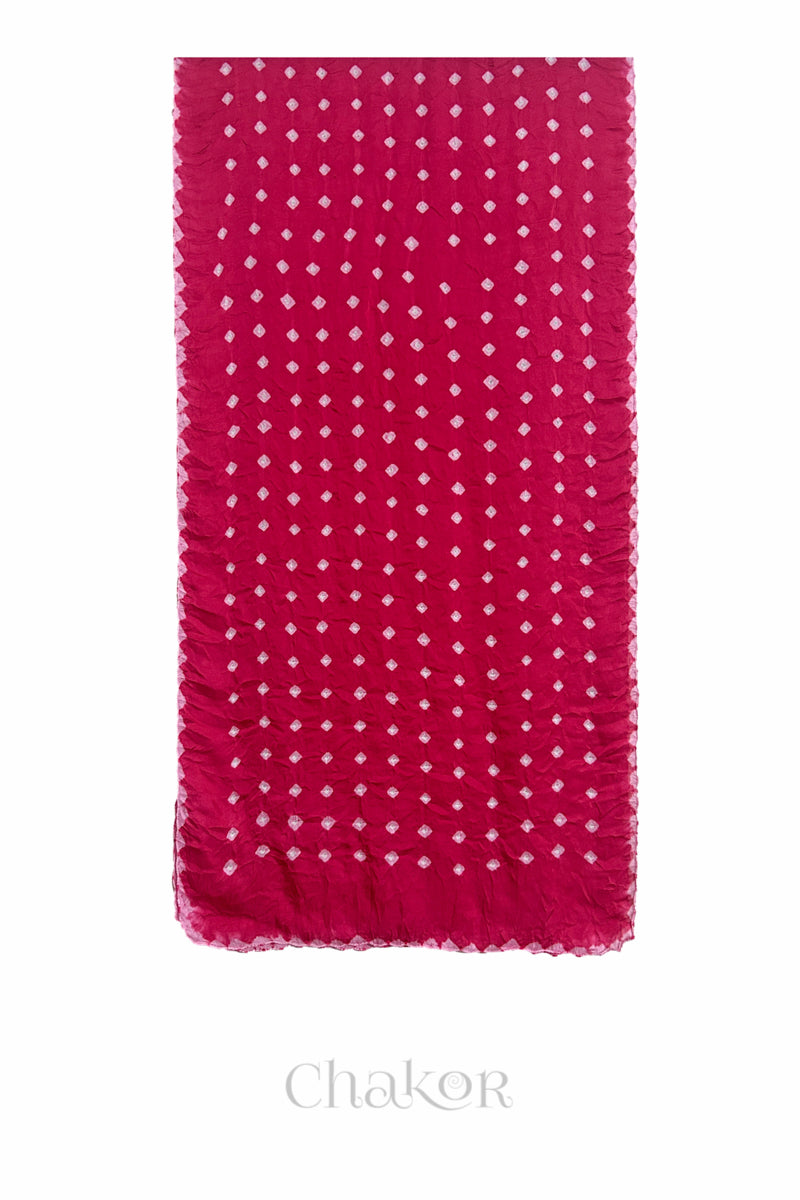 Flat view of pink Bandhani modal stole showing evenly spaced tie-dye pattern.
