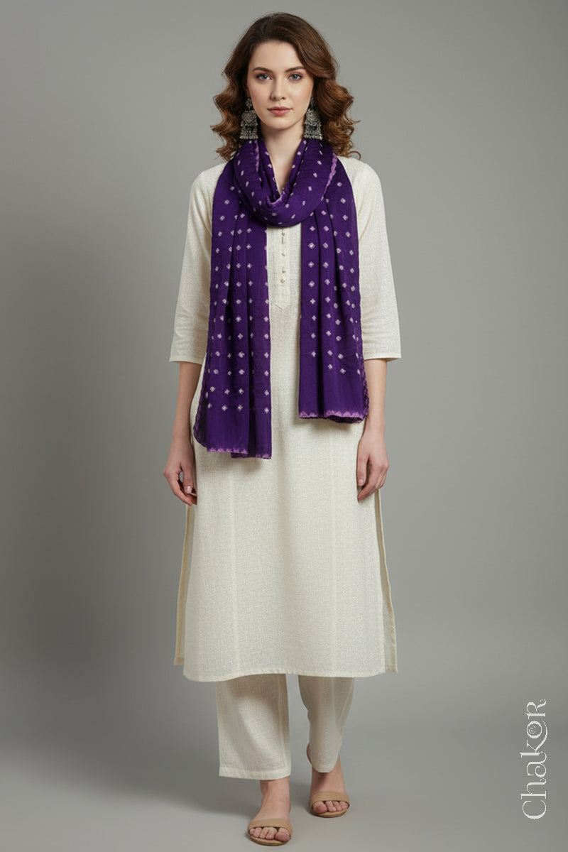 Model wearing a purple Bandhani modal stole styled over a kurta, showing hand tie-dye patterns.
