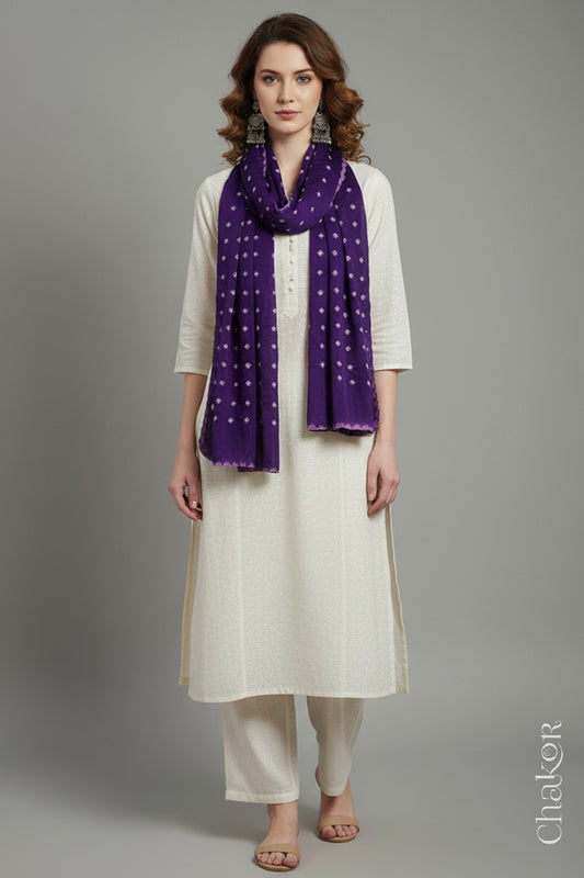 Model wearing a purple Bandhani modal stole styled over a kurta, showing hand tie-dye patterns.
