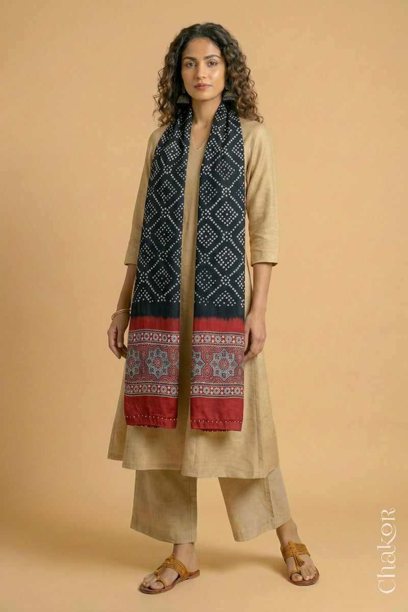 Handcrafted  Bandhani Ajrakh modal stole draped on model with Black Bandhani body and Madder Red Ajrakh pallu.
