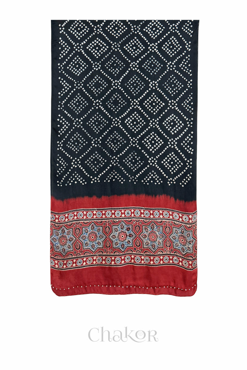 Black Bandhani modal stole with Manjistha Red Ajrakh pallu and traditional block print layout and glass bead edging.
