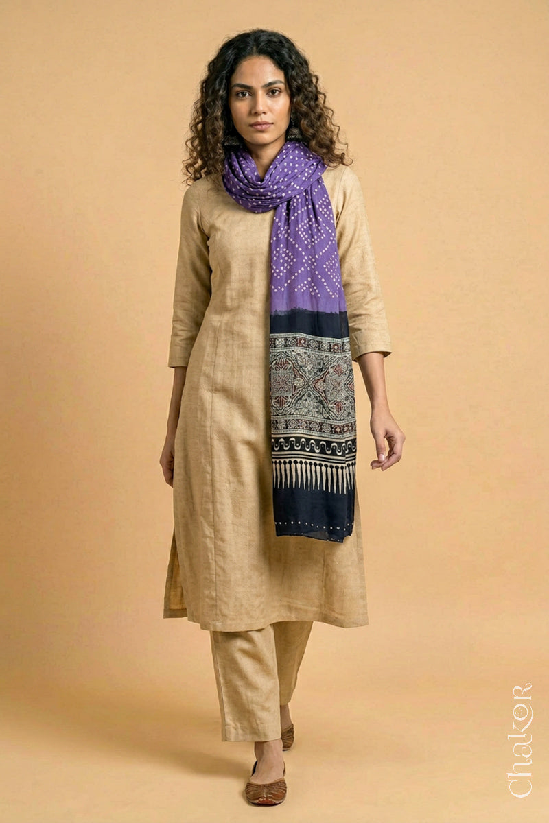 Full length view of handcrafted Mauve Bandhani stole with iron  black ajrakh pallu worn as dupatta wrapped around the neck.
