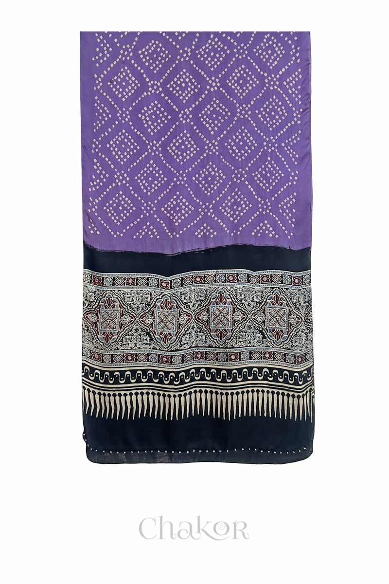 Mauve Bandhani modal stole with black Ajrakh pallu and traditional block print layout and glass bead edging.
