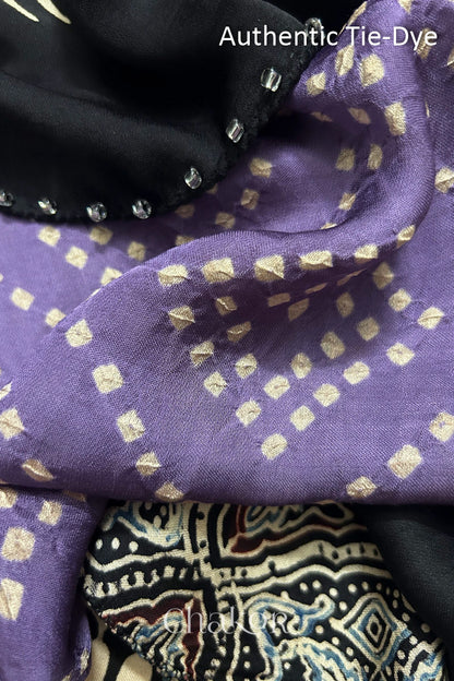 Mauve Hand tied Bandhani dots on modal stole with contrast ajrakh pallu detail.
