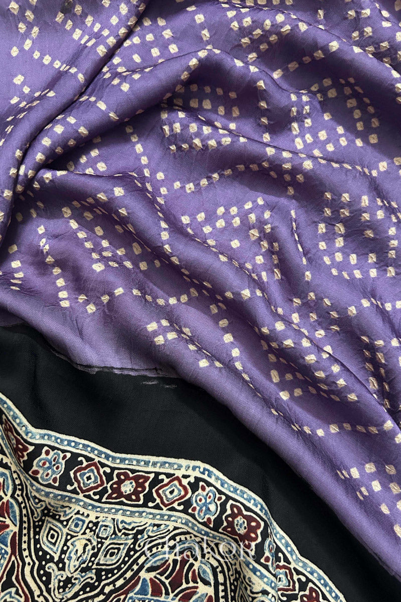 Close up of natural dye black Ajrakh print on handcrafted stole with intricate block printed motifs and delicate bandhani patterns.

