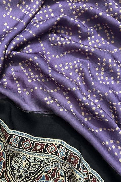 Close up of natural dye black Ajrakh print on handcrafted stole with intricate block printed motifs and delicate bandhani patterns.
