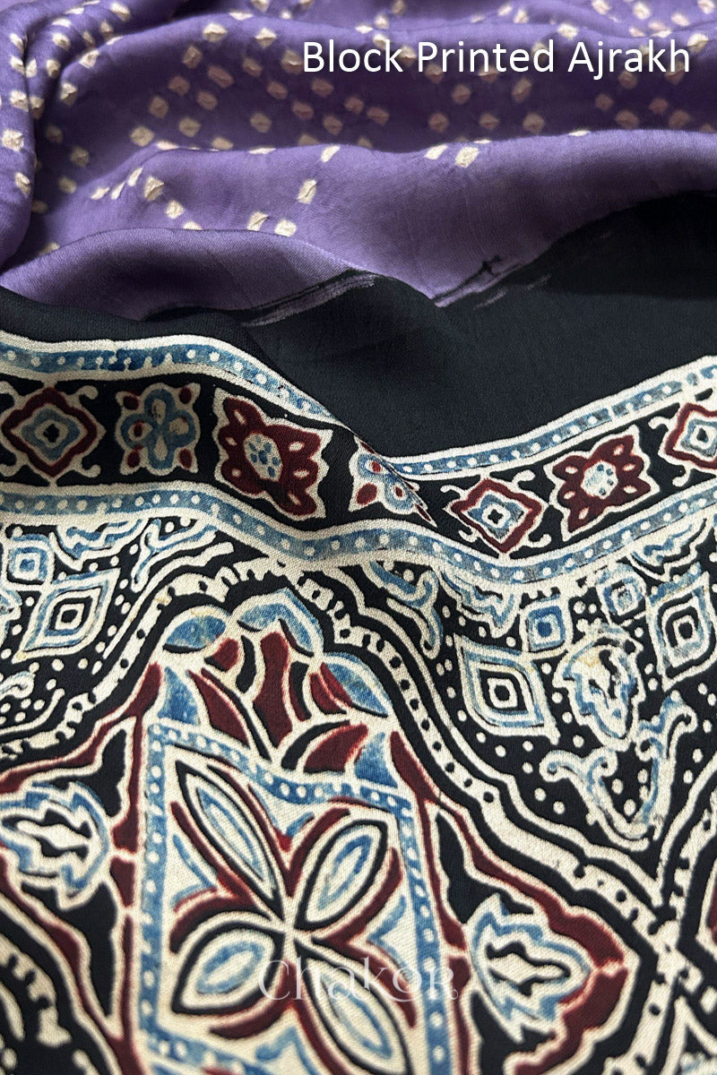 Detailed Ajrakh pattern on modal stole showing traditional hand block printing and intricate bandhani motifs.
