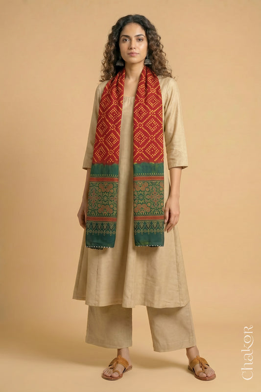 Handcrafted Bandhani Ajrakh modal stole draped on model with  Red Bandhani body and Green Ajrakh pallu.

