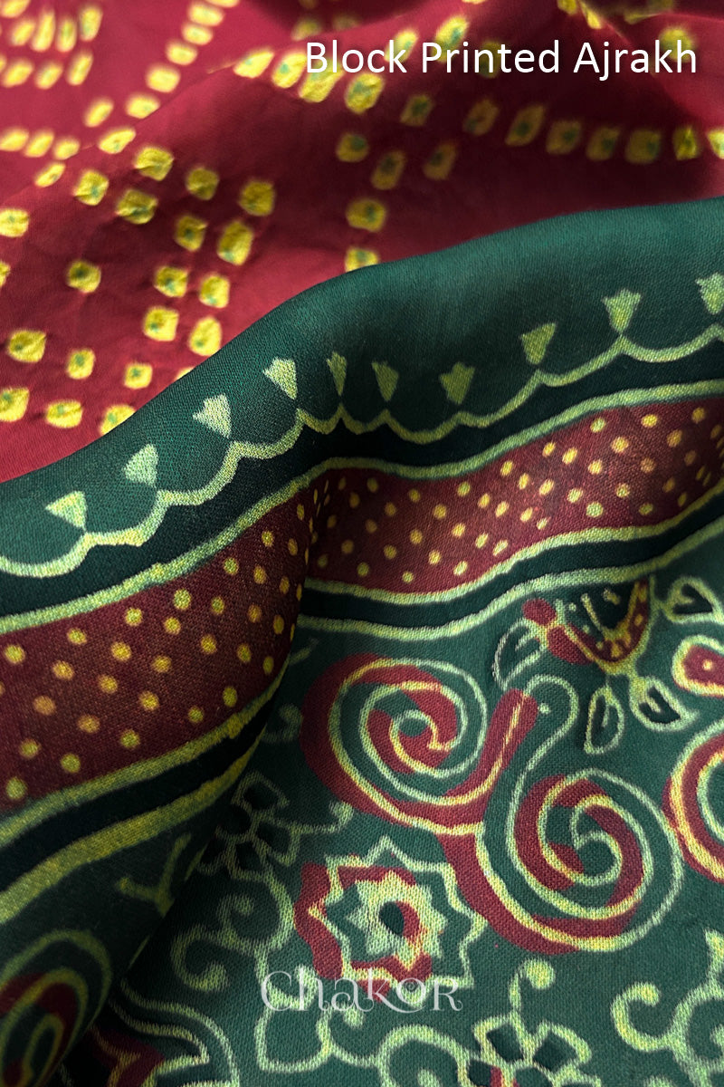 Close up of natural dye Green Ajrakh print on handcrafted stole with intricate block printed motifs and delicate bandhani patterns.
