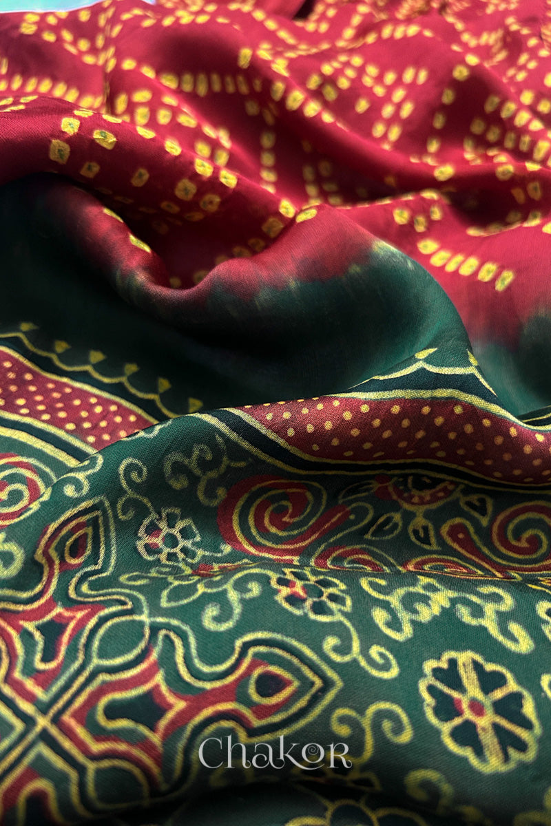 Detailed Ajrakh pattern on modal stole showing traditional hand block printing and intricate bandhani motifs.

