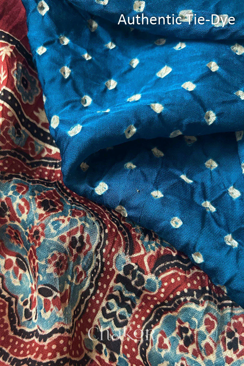 Blue Hand tied Bandhani dots on modal stole with contrast ajrakh pallu detail.
