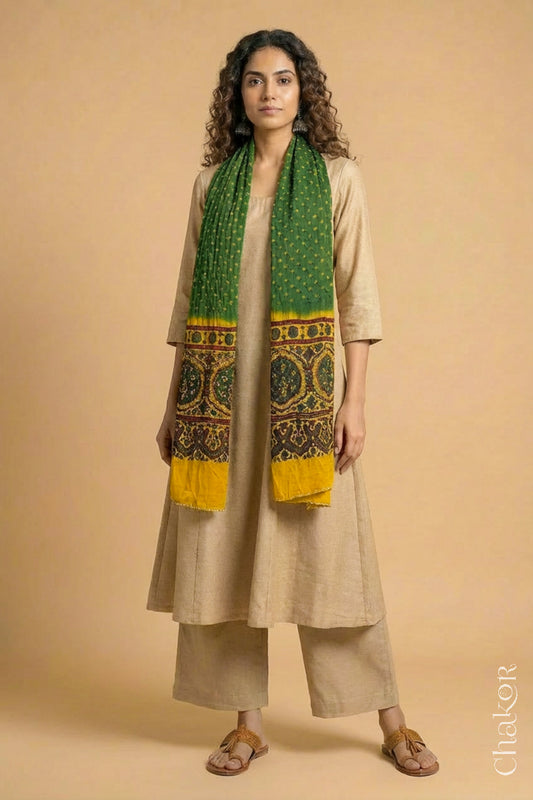 Handcrafted Bandhani Ajrakh modal stole draped on model with Green Bandhani body and Mustard Ajrakh pallu.
