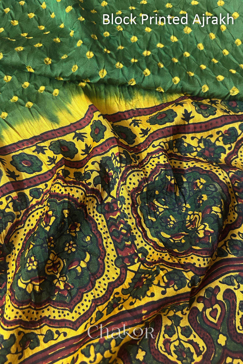 Close up of natural dye Mustard Ajrakh print on handcrafted stole with intricate block printed motifs and delicate bandhani patterns.
