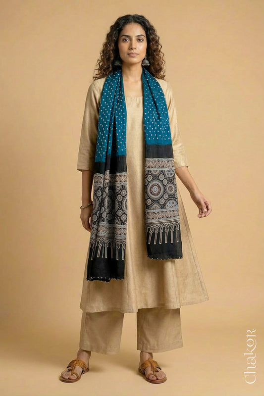 Handcrafted Bandhani Ajrakh modal stole draped on model with indigo blue Bandhani body and black Ajrakh pallu.
