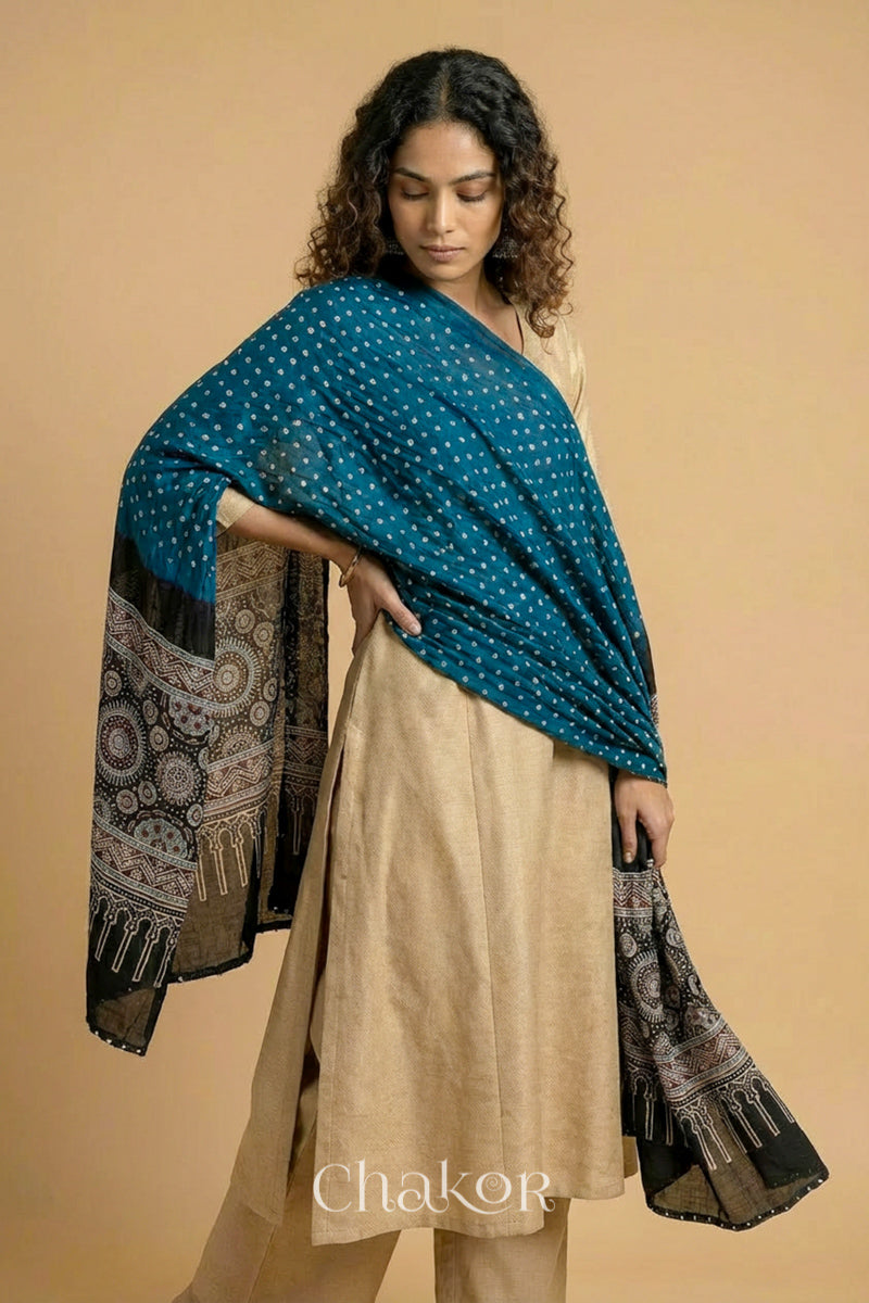 Flowing indigo blue modal Bandhani stole with iron  black  Ajrakh pallu showing movement and lightweight drape.

