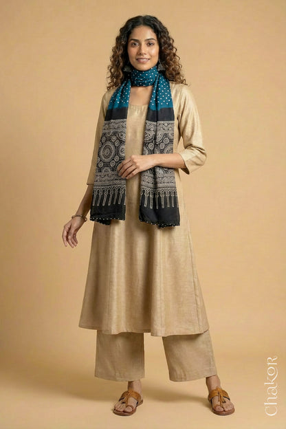 Full length view of handcrafted indigo blue Bandhani stole with iron  black ajrakh pallu worn as dupatta wrapped around the neck.
