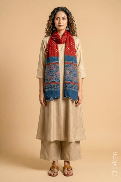 Full length view of handcrafted  Red Bandhani stole with Indigo Ajrakh pallu worn as dupatta wrapped around the neck.
