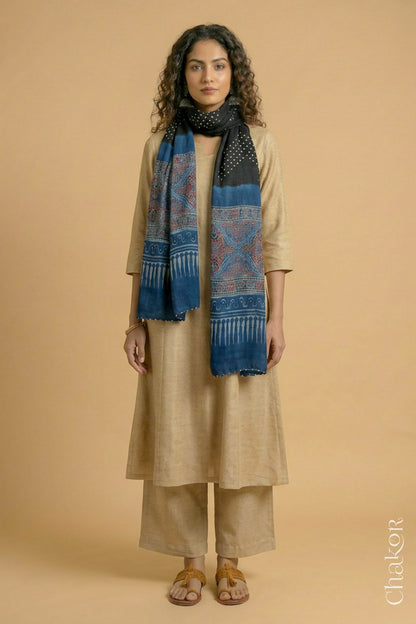 Handcrafted Bandhani Ajrakh modal stole draped on model with Black Bandhani body and Indigo Ajrakh pallu.
