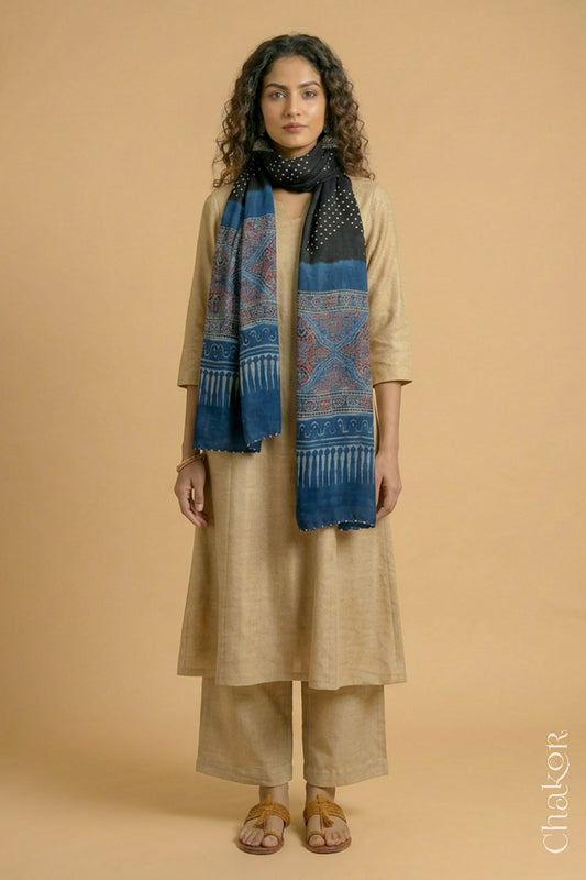 Handcrafted Bandhani Ajrakh modal stole draped on model with Black Bandhani body and Indigo Ajrakh pallu.
