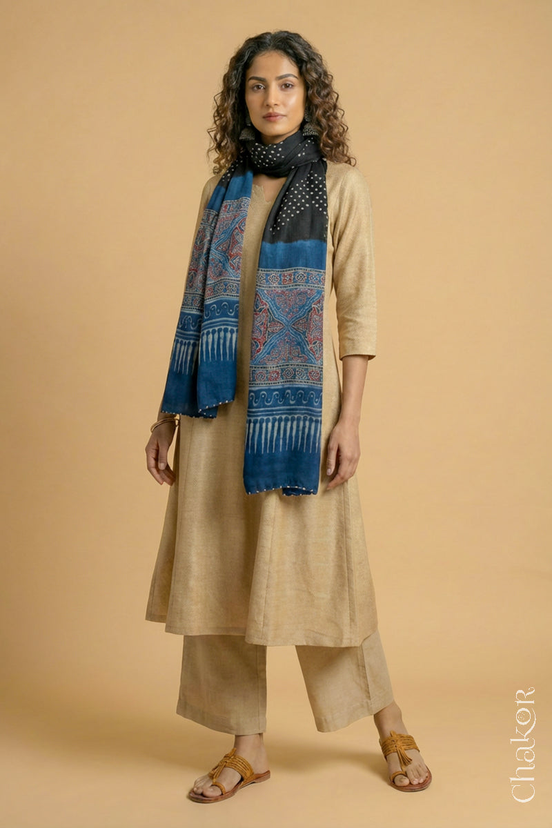 Full length view of handcrafted  Black Bandhani stole with Indigo Ajrakh pallu worn as dupatta wrapped around the neck.
