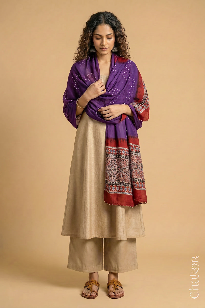 Flowing purple modal Bandhani stole with Madder Red  Ajrakh pallu showing flowy and lightweight drape.
