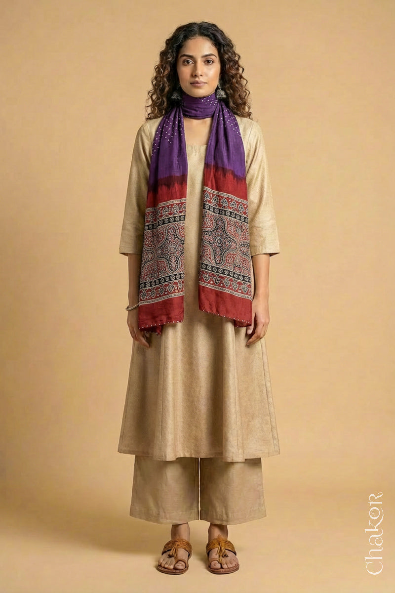 Full length view of handcrafted Purple Bandhani stole with iron  Madder Red Ajrakh pallu worn as dupatta wrapped around the neck.
