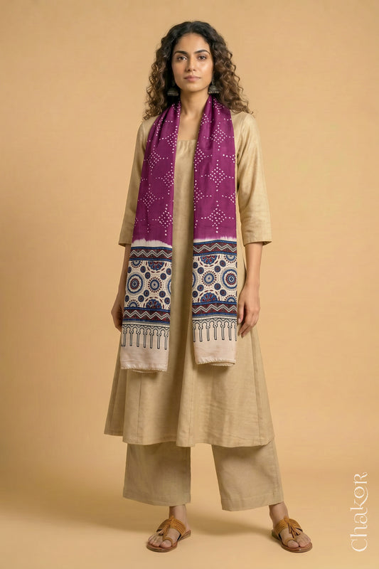 Handcrafted Bandhani Ajrakh modal stole draped on model with Magenta Bandhani body and Off-white Ajrakh pallu.
