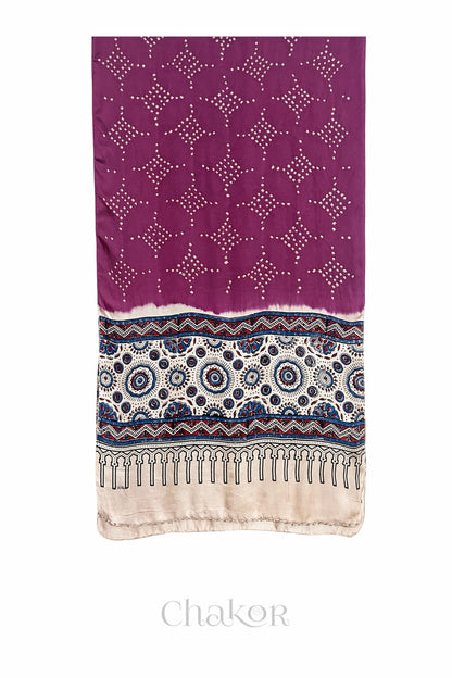Magenta Bandhani modal stole with  Off-white Ajrakh pallu and traditional block print layout and glass bead edging.
