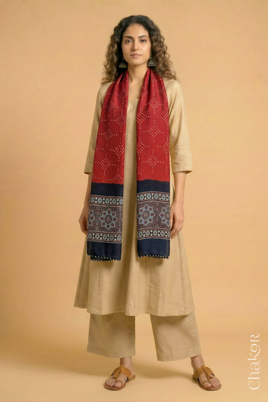 Handcrafted Bandhani Ajrakh modal stole draped on model with Red Bandhani body and black Ajrakh pallu.
