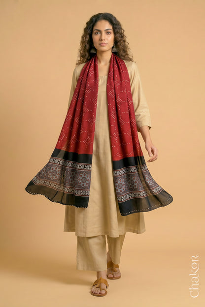 Flowing Red modal Bandhani stole with iron  black  Ajrakh pallu showing movement and lightweight drape.
