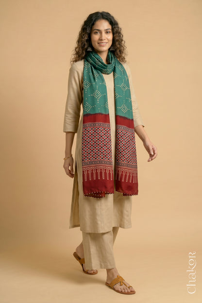 Full length view of handcrafted Turtle Green Bandhani stole with iron  Madder Red Ajrakh pallu worn as dupatta wrapped around the neck.
