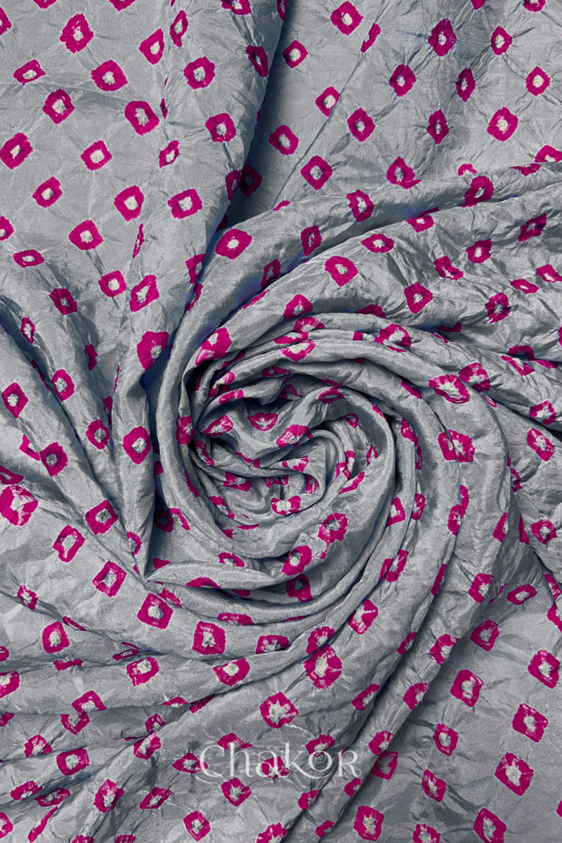 Light Grey Mulberry silk fabric with dual colour Pink bandhani dots, arranged in a swirling design  & Chakor brand watermark.

