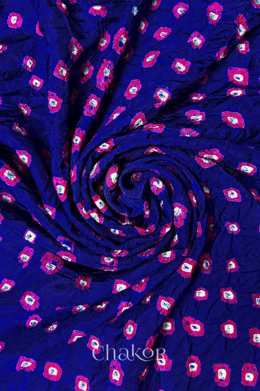 Navy Mulberry silk fabric with dual colour Pink bandhani dots, arranged in a swirling design  & Chakor brand watermark.
