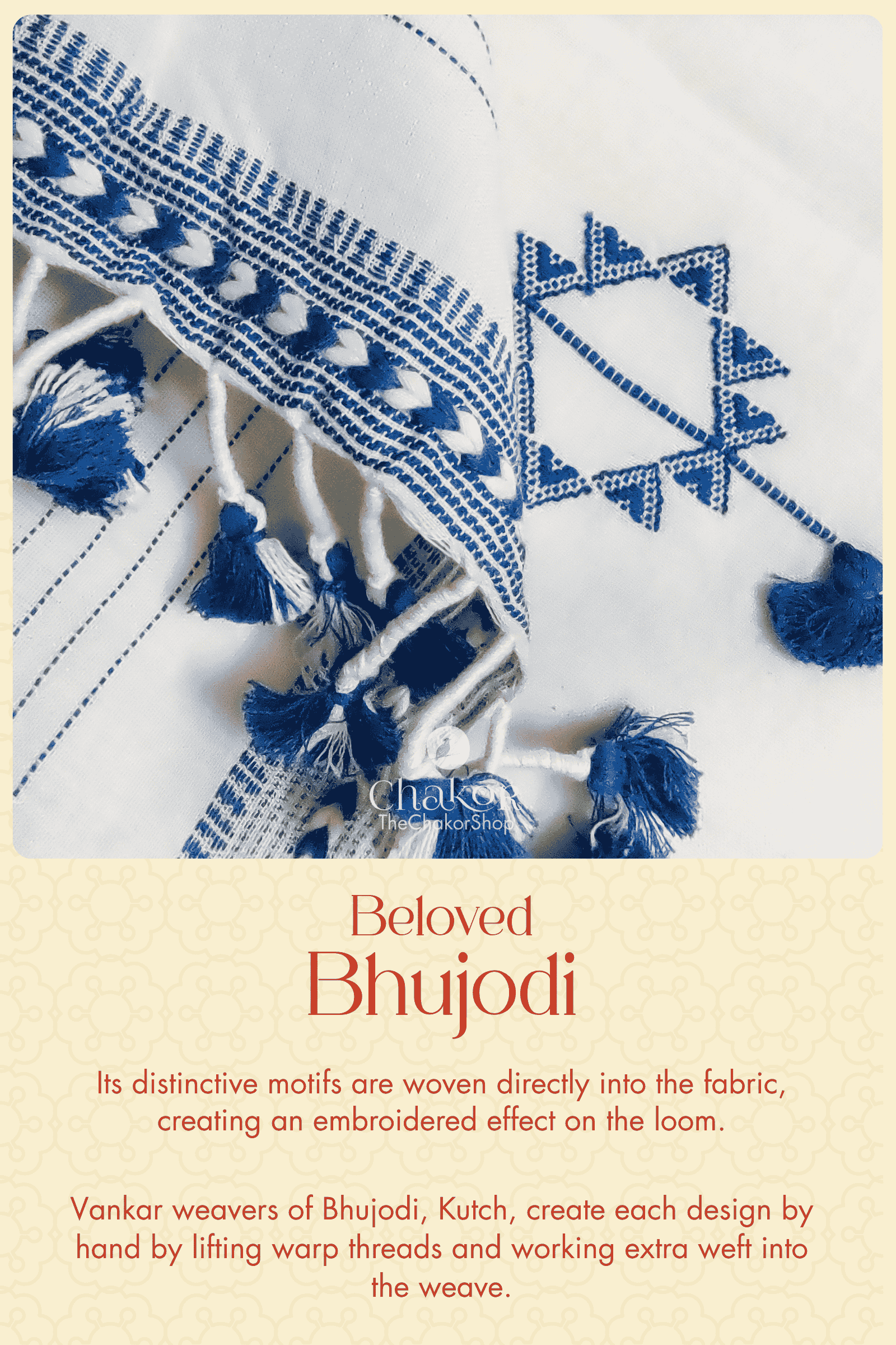 Close-up of blue and white Bhujodi with geometric motifs woven directly into the fabric, creating an embroidered effect on the loom.
